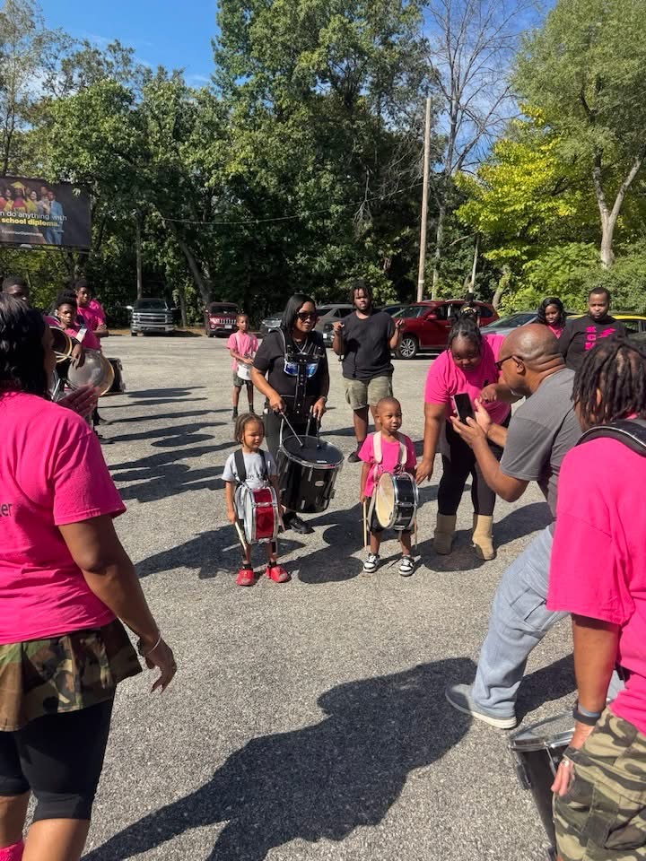 Eastwood families and kids drumming together at a community event