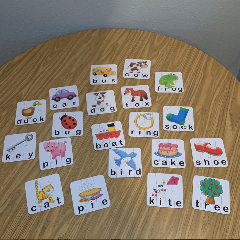 Eastwood children working on alphabet picture puzzles to build vocabulary and letter recognition